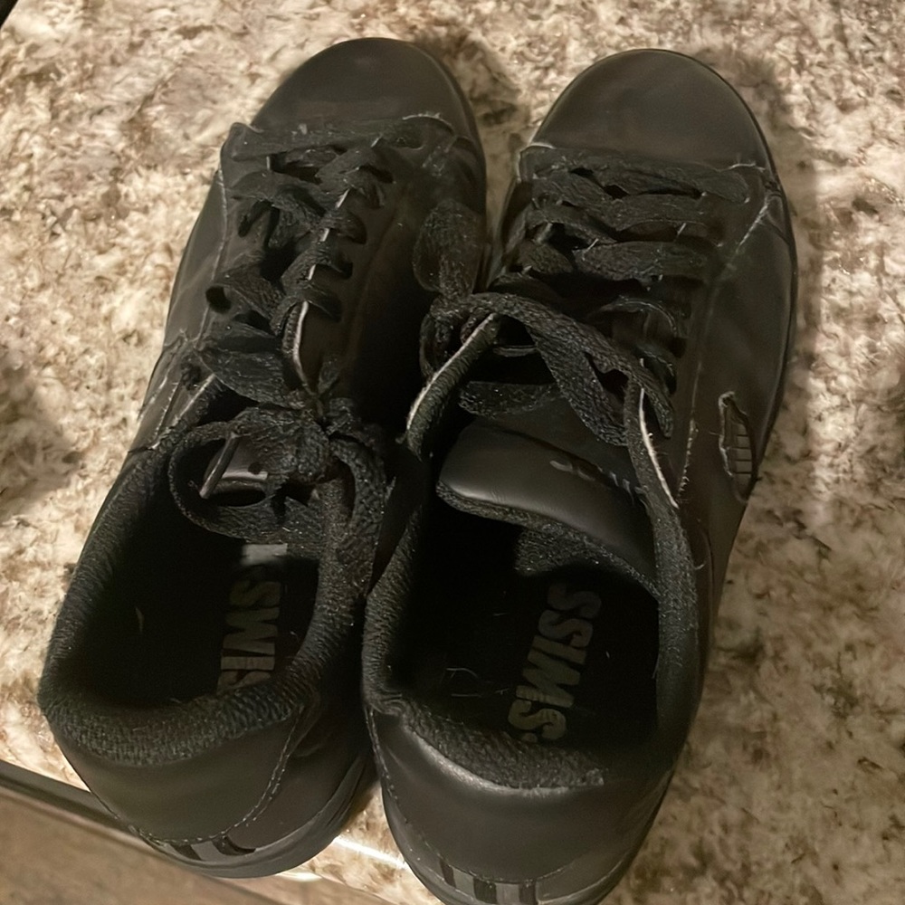 Gently used black sneakers.
